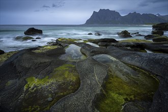 Seascape on the beach at Uttakleiv (Utakleiv), in the foreground rocks and the so-called Eye of