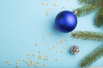 Christmas or New Year composition. Decorations, blue balls, cones, fir and spruce branches, on a