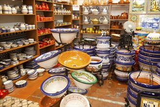 Display of tiles and pottery inside Santa Ana ceramic tile shop in Triana, Seville, Spain, Europe