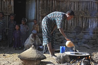 Amhara region, simple family, small farm, self-sufficient, making teff bread, called injera,