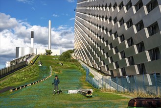 CopenHill, waste incineration plant and artificial ski slope, skiing with a view of the ski lift,