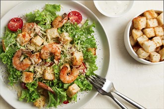 Caesar salad, with shrimp, on a white background, homemade, no people