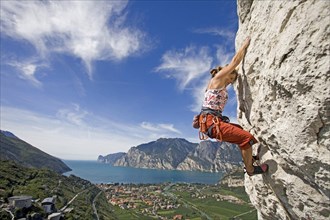 Young blonde fRau climbs on mountain, 35, years