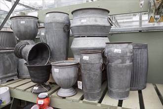 Display of metal planting containers, The Walled garden plant nursery, Benhall, Suffolk, England,