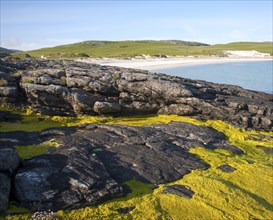 Rocky headland and sandy beach at Bagh a Deas, South Bay, Vatersay island, Barra, Outer Hebrides,