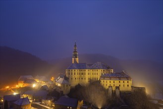 Winter evening in the Müglitz valley, impressively illuminated Weesenstein Castle at the blue hour,