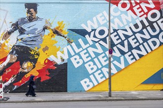 Large-format mural welcoming football fans to EURO 2024 at Dortmund Central Station, North