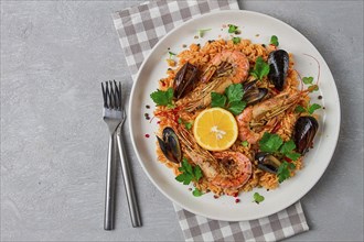 Seafood paella, shrimp and mussels risotto, rice, homemade, top view, no people