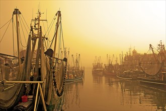 Sunrise in the harbour of Neuharlingersiel, East Frisia, Lower Saxony, Federal Republic of Germany