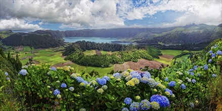 Panoramic view of the picturesque crater landscape of the Caldeira das Sete Cidades with the lake