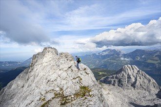 Mountaineer on a narrow rocky ridge, Watzmann crossing to Watzmann Mittelspitze, view of mountain