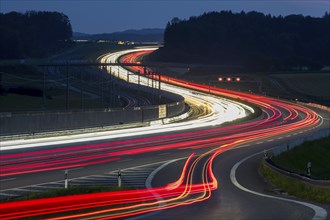 Tracers on the A8 motorway, winding road, evening, long exposure, Swabian Alb, Baden-Württemberg,