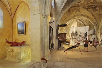 Art exhibition in the church Sainte-Marie de l'Assomption, interior view, visitors,