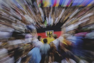 Fans react during the European Championship preliminary round match between Germany and Hungary on