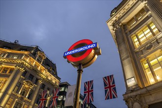 English flags, Underground sign, Underground, illuminated historical buildings, Oxford Circus,