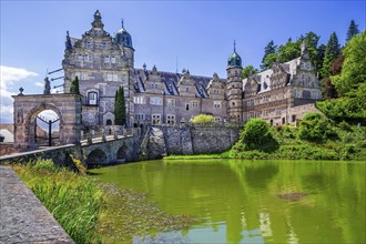 Castle with castle pond of HÃ¤melschenburg Castle, Weser Renaissance castle, municipality of