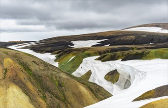 Colourful volcanic landscape with hills and snow, Laugavegur trekking trail, Landmannalaugar,