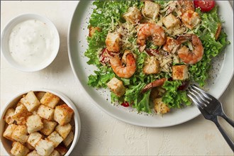 Caesar salad, with shrimp, on a white background, homemade, no people