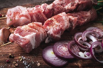 Raw pork meat, on wooden sticks, pickled kebab, with spices, top view, no people