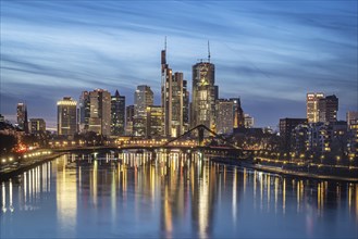 Skyline in the evening, skyscrapers of the banking district are reflected in the Main, Frankfurt am