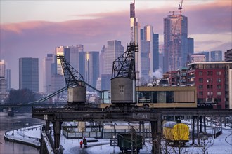 The skyline of Frankfurt am Main, skyscrapers of the banking district, historic harbour cranes at