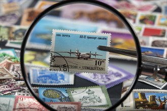 Stamp collection, collecting, postage stamps, postage stamps from different countries, magnifying