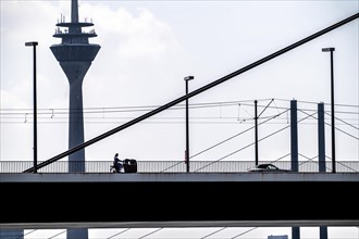 Oberkassler Bridge over the Rhine near Düsseldorf, in front, behind the Rheinknie Bridge, cargo