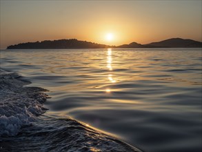 Evening sun over the sea, in front of sunset, island world off Vodice, Dalmatia, Croatia, Europe