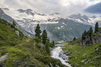 Mountain landscape with mountain stream Zemmbach and mountain hut Berliner Hütte, behind mountain