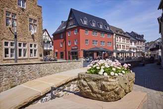 Town centre and pedestrian zone with houses and buildings made of sandstone in Bad Münstereifel,