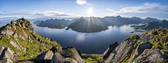 Panorama, view of Fjord Raftsund and mountains in the evening light, sun star, summit of