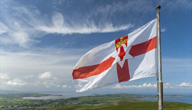 The flag of Northern Ireland flutters in the wind