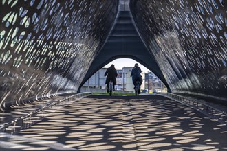 Light effects from the sun in the Parkbruk, a cycle and pedestrian bridge in the city centre of