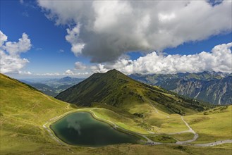 Riezler Alpsee, an artificial lake, snow pond, feeds the snow cannons that completely cover the