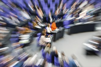 Zoom effect photo, Member of Parliament in the plenary hall of the German Bundestag, Berlin, 13