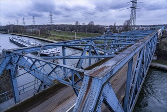 The Rhine-Herne Canal in Oberhausen, bus and tram bridge, canal boat, freighter, North