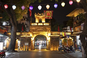 Illuminated old town gate at night, Hanoi, Vietnam, Asia