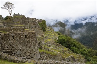 Inca ruins of Machu Picchu in the clouds, Cusco region, Peru, South America