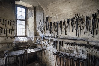 Historic forge, workshop with tools and workbench, museum, Salem Castle, former imperial abbey,