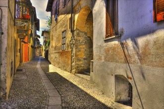 Old Beautiful Narrow Stone Alley in a Sunny Day in Cannobio, Piedmont, Italy, Europe