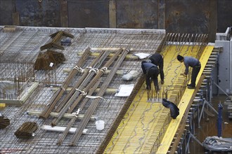 Construction site, reinforced concrete reinforcement bars, for a building ceiling, are installed