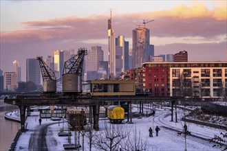 The skyline of Frankfurt am Main, skyscrapers of the banking district, historic harbour cranes at