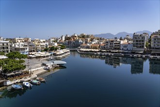 The village of Agios Nikolaos, in the eastern part of Crete, view over Lake Voulismeni, connected