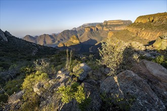 Sunset at Blyde River Canyon with Three Rondawels peak, view of canyon with Blyde River and Mesa