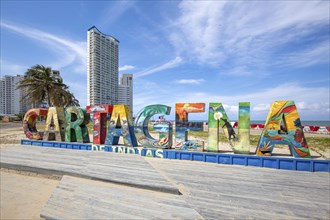 Cartagena, Colombia, 18 July, 2022: Big welcoming Cartagena letters on a public beach near the