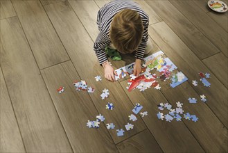 Child playing with a puzzle, Oostkapelle, 20.01.2024