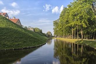 Ancient restored castle with a moat in the Nesvizh city. Belarus