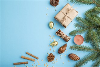 Christmas or New Year composition. Decorations, box, cinnamon, cones, fir and spruce branches, on a