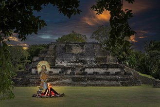 Maya at campfire in front of pyramid Altun Belize Central America Fire Via KI Maya built in