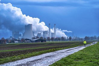 Field path, woman walking her dog, lignite-fired power plant, RWE Power AG NiederauÃŸem power